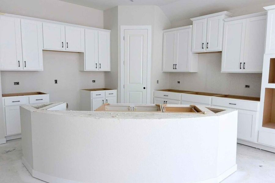 Kitchen featuring white cabinets and a kitchen island