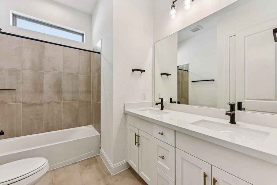 Furnished interior view inside a new home in 6 Creeks, Kyle (Image 7).