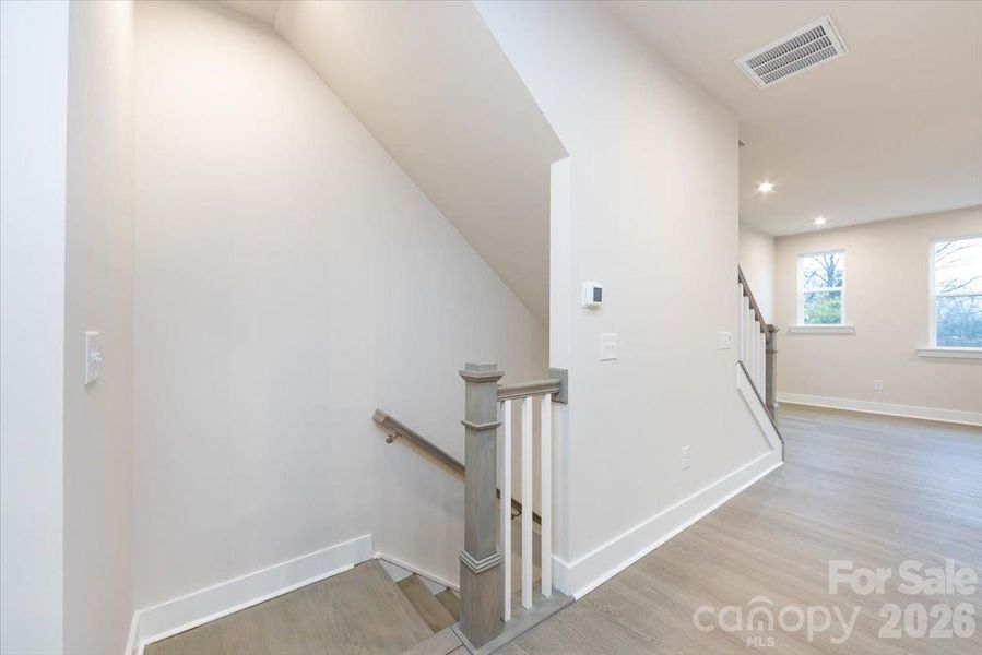 Second floor landing with open rails on the stairs