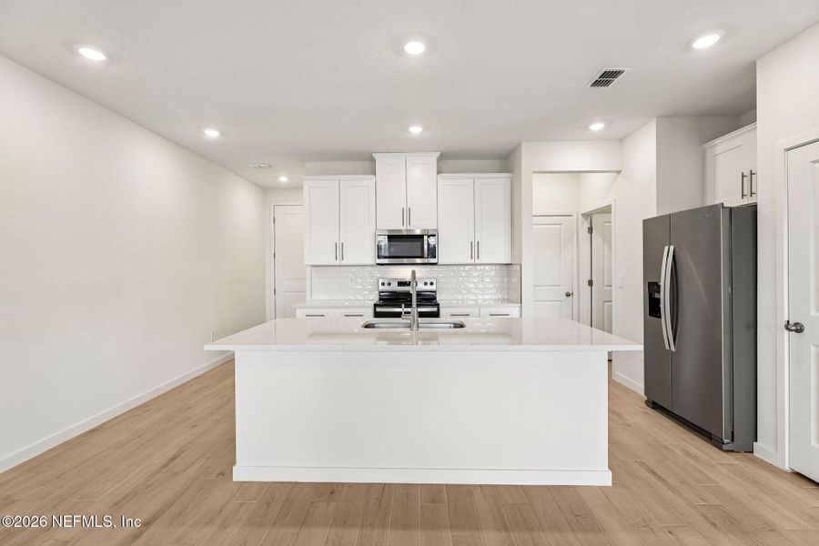 Furnished interior view inside a new home in The District at Oakleaf - The Grove, Middleburg (Image 4).