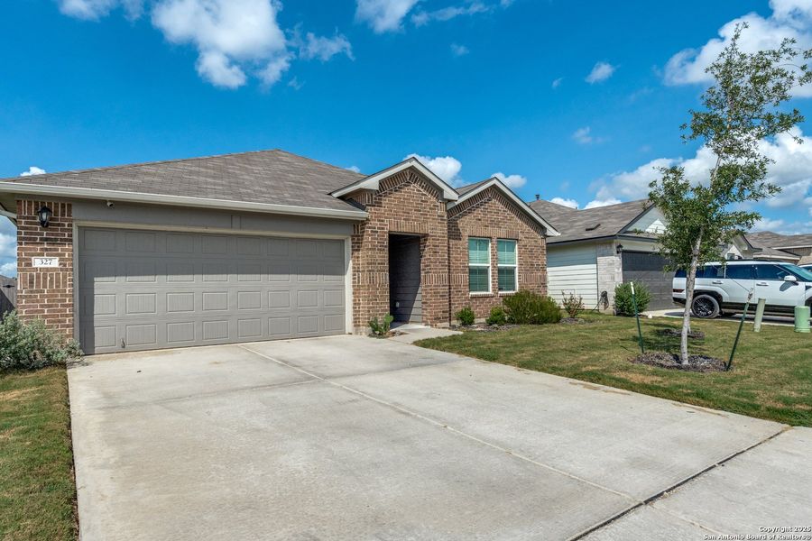 Front exterior of a new home in Heather Glen, New Braunfels, TX, highlighting curb appeal (Image 19). Front exterior of a new home in Heather Glen, New Braunfels, TX, highlighting curb appeal (Image 19).