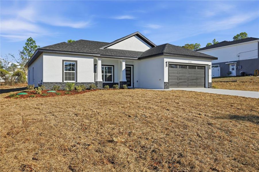 Front exterior of a new home in , Brooksville, FL, highlighting curb appeal (Image 23).