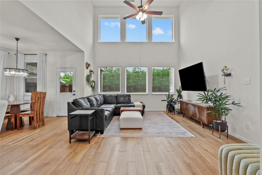 Soaring ceilings with floor to ceiling windows make this home bright and airy
