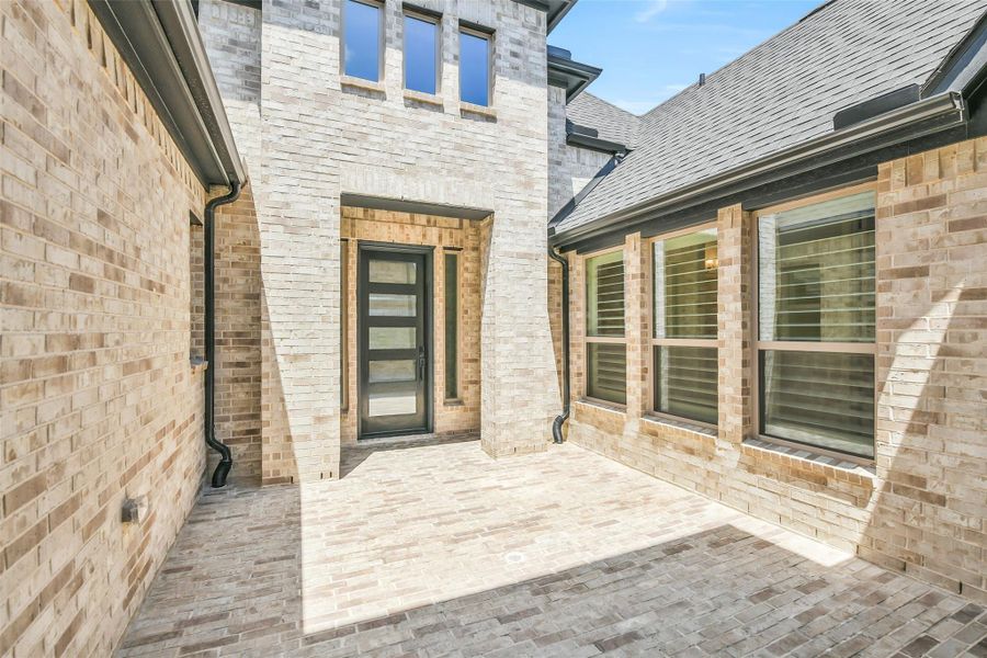 The brick front courtyard measures 13x14. Owners have added a Holiday Lighting Soffit Duplex Outlet. The brick front courtyard measures 13x14. Owners have added a Holiday Lighting Soffit Duplex Outlet.