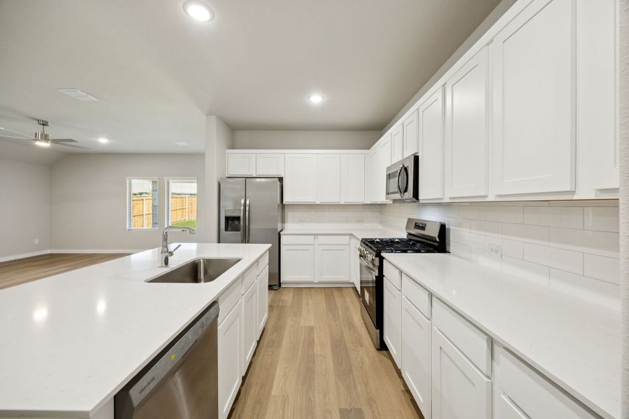 Kitchen in the Oscar home plan by Trophy Signature Homes – REPRESENTATIVE PHOTO Kitchen in the Oscar home plan by Trophy Signature Homes – REPRESENTATIVE PHOTO