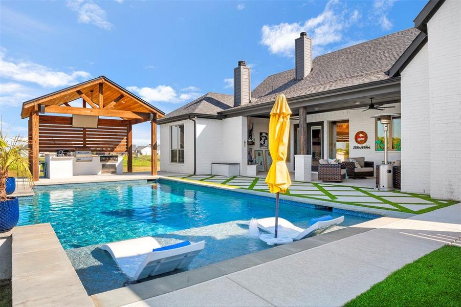 Swimming pool featuring area for grilling, ceiling fan, a patio, and an outdoor hangout area