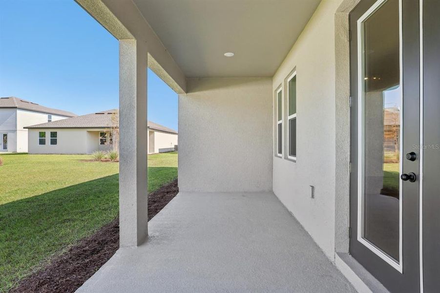 Exterior details and patio area of a home in Tyson Reserve, St. Cloud (Image 4).