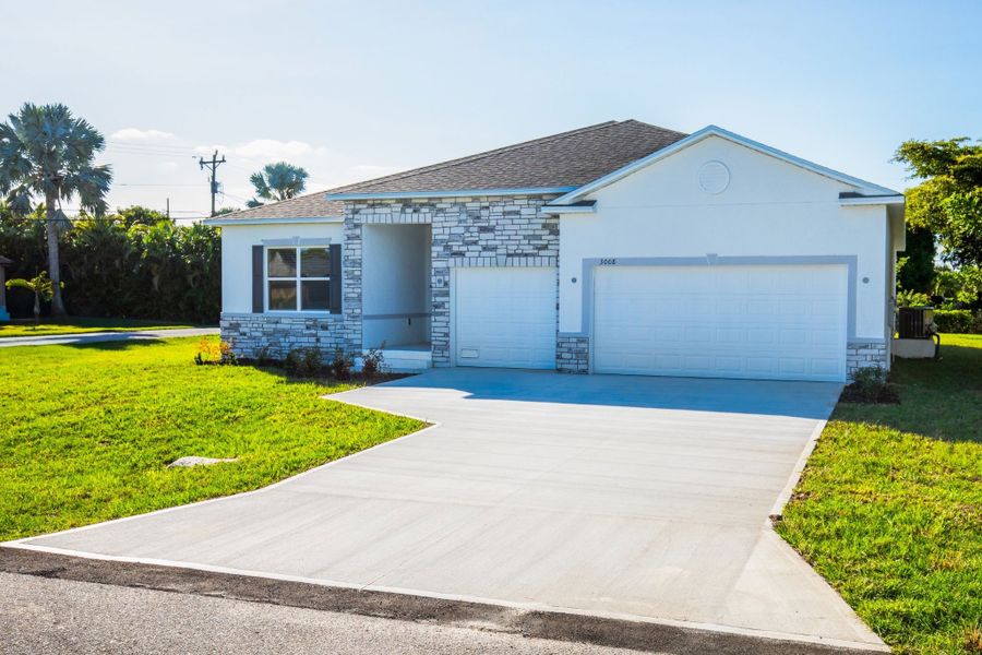 Front exterior of a new home in Cape Coral, Cape Coral, FL, highlighting curb appeal (Image 16).