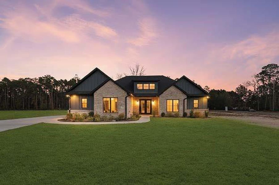 Front exterior of a new home in , Conroe, TX, highlighting curb appeal (Image 26).