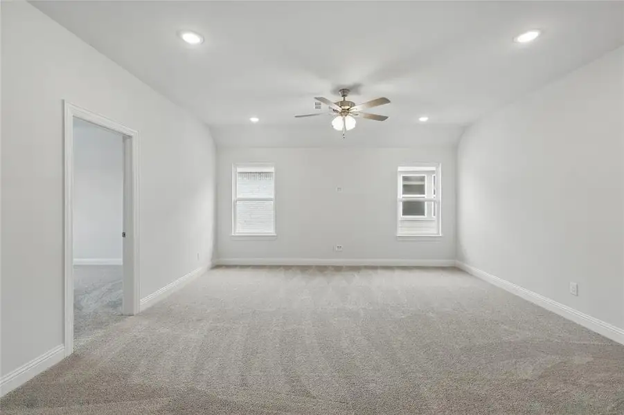 Unfurnished room with light carpet, baseboards, recessed lighting, and a ceiling fan