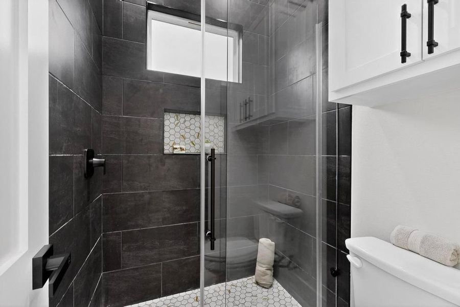 Hall Bathroom #3 with a shower stall and toilet Hall Bathroom #3 with a shower stall and toilet