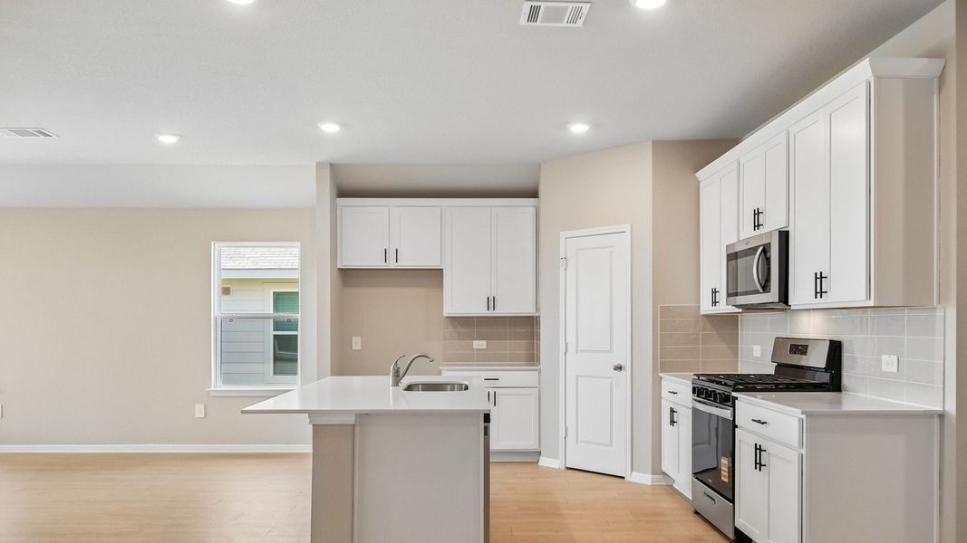 Furnished interior view inside a new home in Carillon, Manor (Image 6).