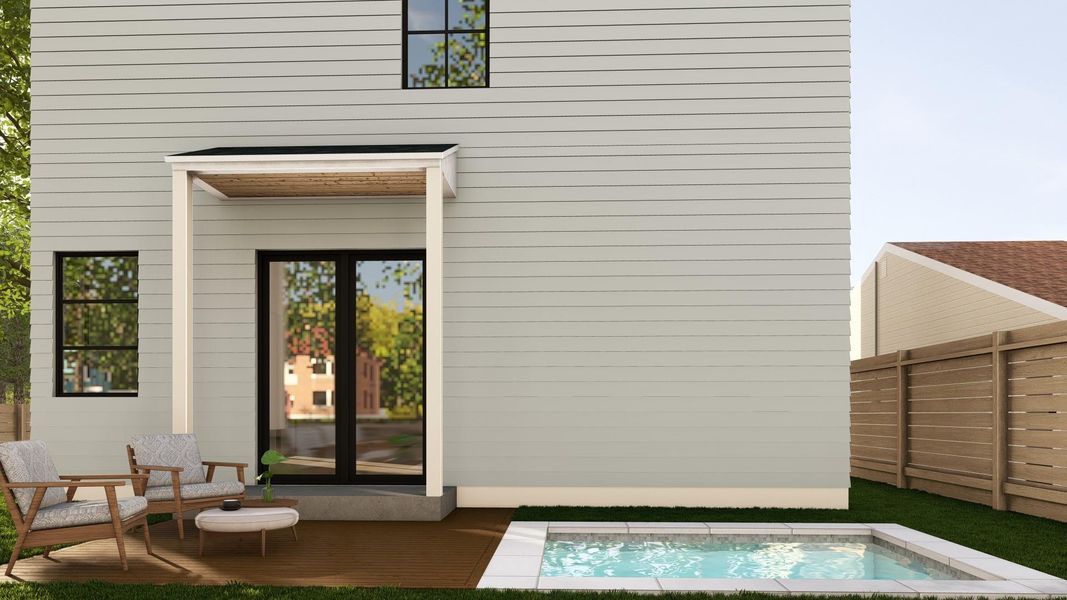 Rear view of property featuring a jacuzzi