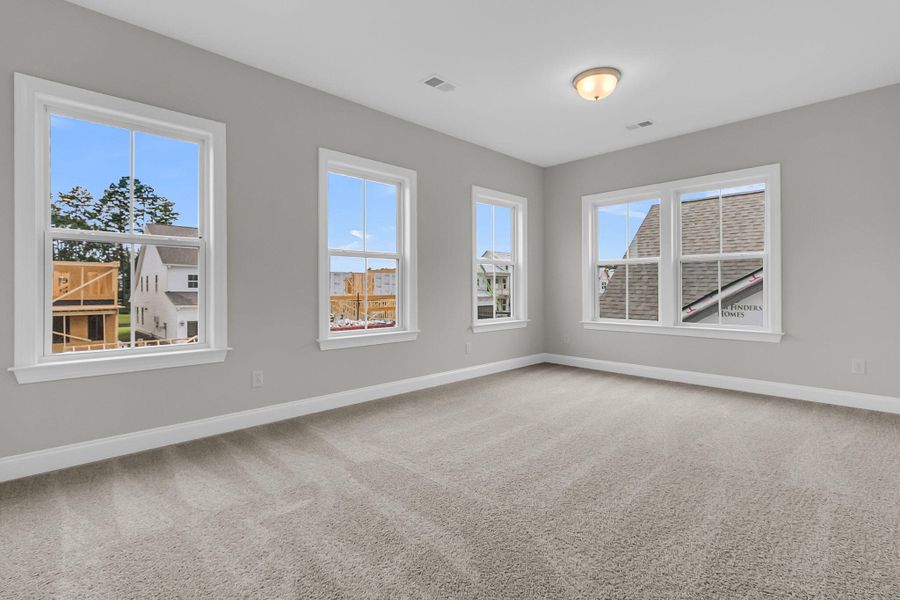 Spacious, unfurnished interior of a new home in Tidewater at Lakes of Cane Bay, Summerville (Image 28).