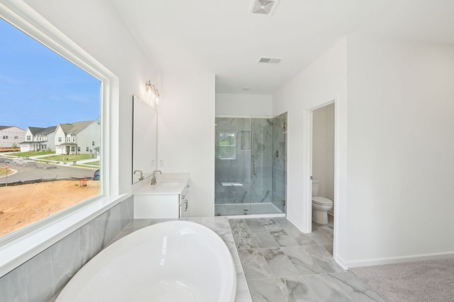 Representative furnished interior of a home built from the Alexis by Ashton Woods in Rowland's Grant, Fuquay Varina (Image 13).