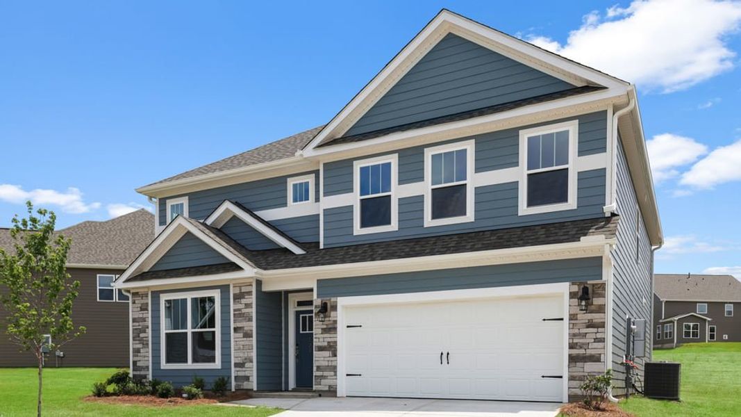 Front exterior of a new home in Adams Glen, Greenville, SC, highlighting curb appeal (Image 2). Front exterior of a new home in Adams Glen, Greenville, SC, highlighting curb appeal (Image 2).