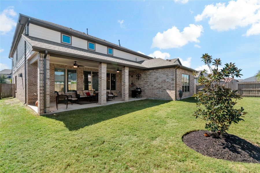 Rear of home with large back patio Rear of home with large back patio