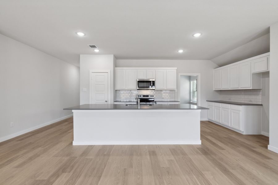 Kitchen in the Harrison home plan by Trophy Signature Homes – REPRESENTATIVE PHOTO