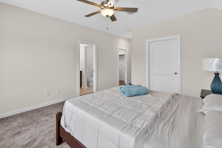 Expansive primary bedroom with seamless access to the ensuite bath and walk-in closet, offering both comfort and convenience. Expansive primary bedroom with seamless access to the ensuite bath and walk-in closet, offering both comfort and convenience.