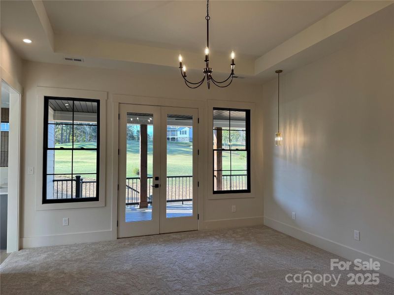 Primary Bedroom With French Doors to Deck Primary Bedroom With French Doors to Deck