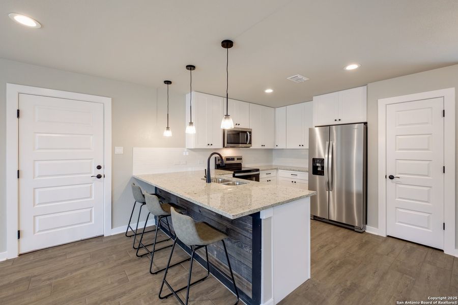 Furnished interior view inside a new home in , Lakehills (Image 12).