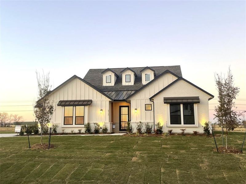 Front exterior of a new home in Highland Crossing, Celina, TX, highlighting curb appeal (Image 1).