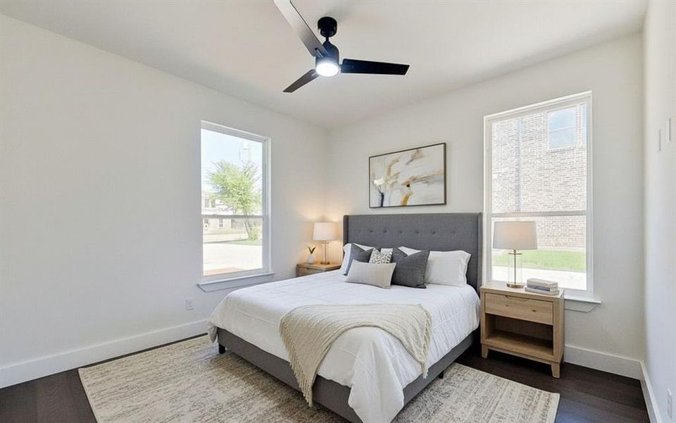 Bedroom featuring a ceiling fan and wood finished floors