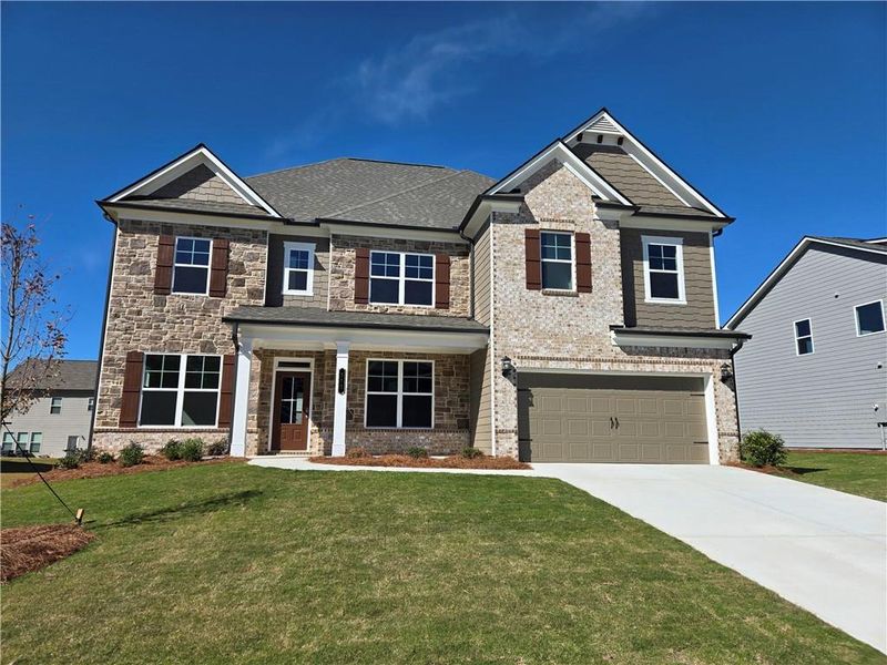 Front exterior of a new home in Enclave at Logan Point, Loganville, GA, highlighting curb appeal (Image 1).