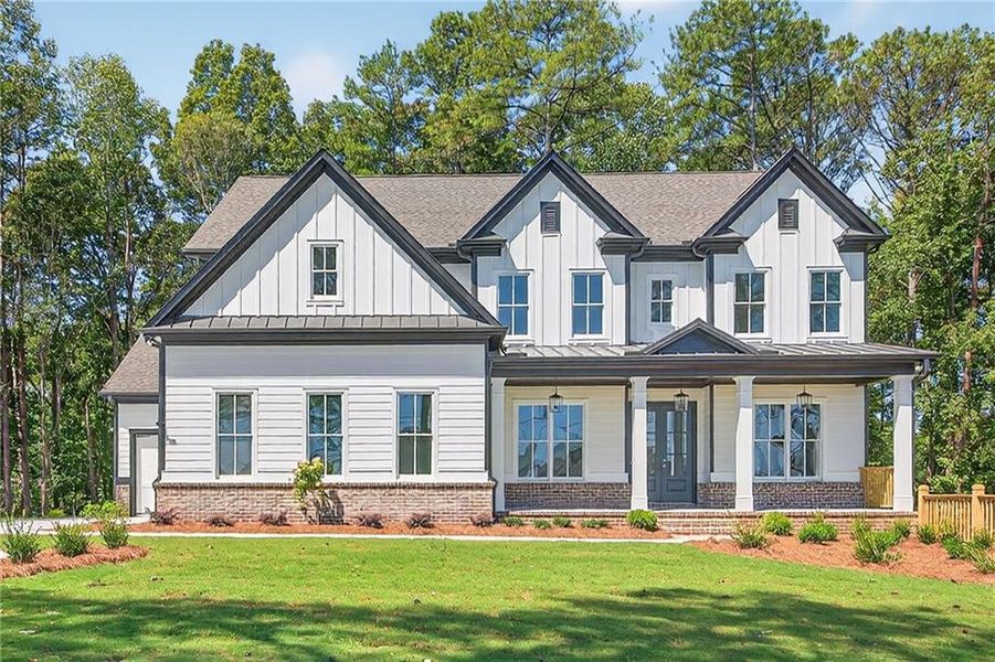 Front exterior of a new home in , Cumming, GA, highlighting curb appeal (Image 31). Front exterior of a new home in , Cumming, GA, highlighting curb appeal (Image 31).