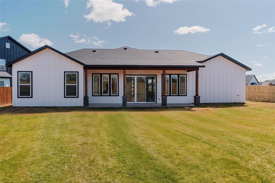 Back of house featuring a extended patio