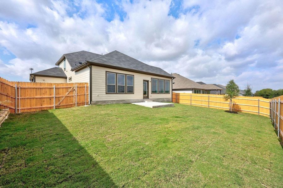 Exterior details and patio area of a home in Prairie Winds, Hutto (Image 3).