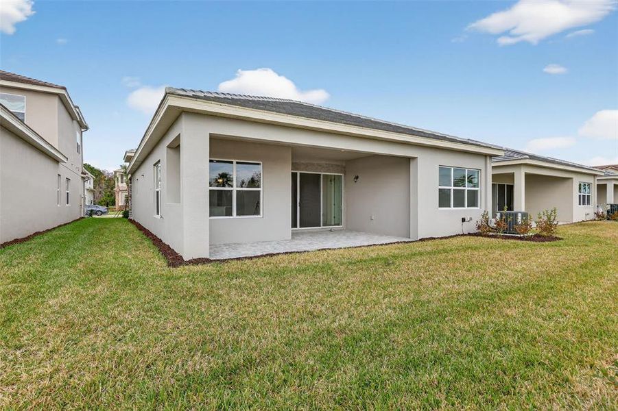 Exterior details and patio area of a home in Winding Ridge, Wesley Chapel (Image 27).