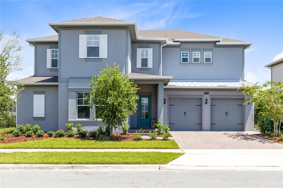 Front exterior of a new home in , Orlando, FL, highlighting curb appeal (Image 2). Front exterior of a new home in , Orlando, FL, highlighting curb appeal (Image 2).