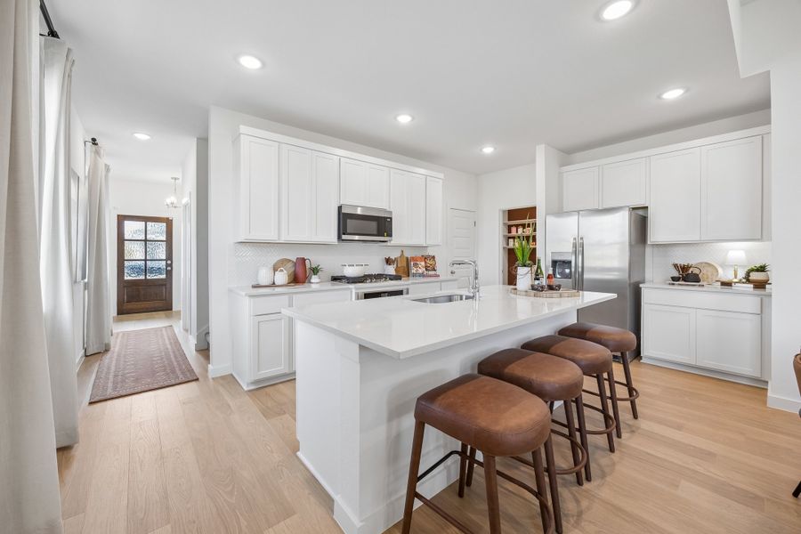 Kitchen in the Magnolia home plan by Trophy Signature Homes – REPRESENTATIVE PHOTO Kitchen in the Magnolia home plan by Trophy Signature Homes – REPRESENTATIVE PHOTO