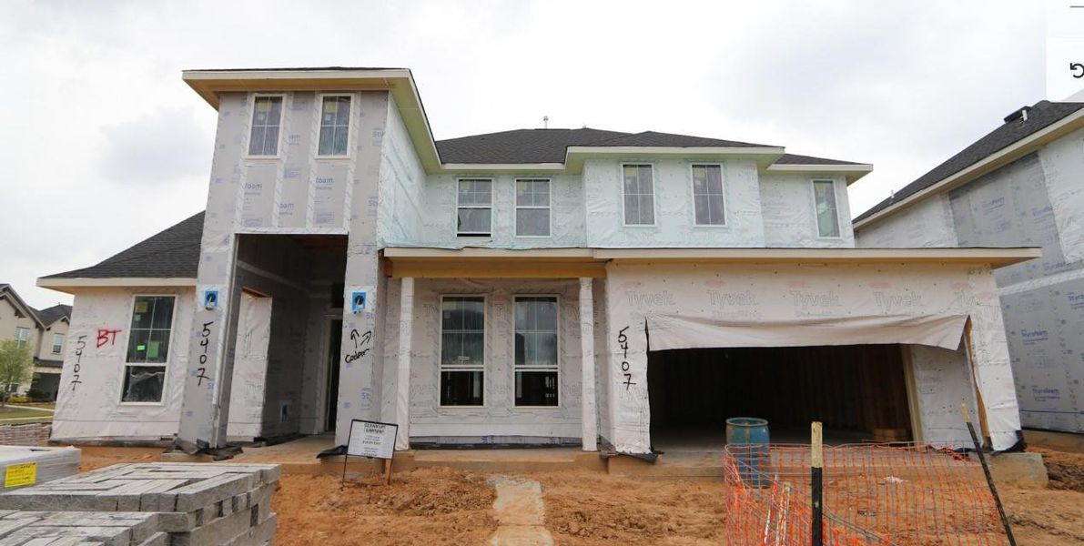 Front exterior of a new home in Cross Creek Ranch 65′, Fulshear, TX, highlighting curb appeal (Image 19).