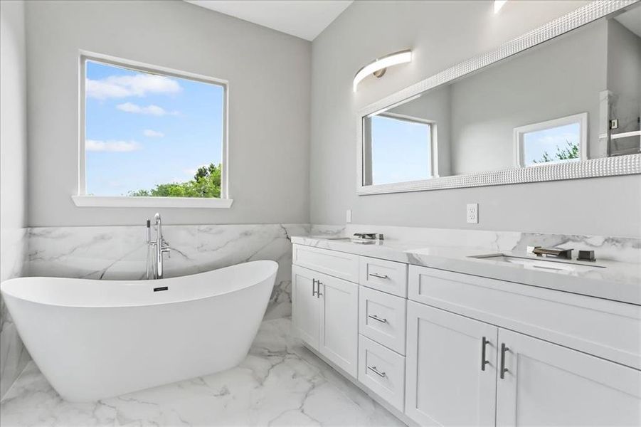 The master bathroom provides a spa oasis.