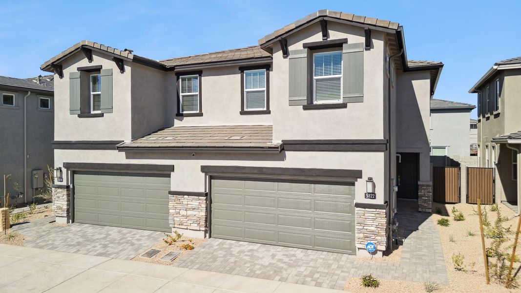 Front exterior of a new home in Talinn Towns at Desert Ridge, Phoenix, AZ, highlighting curb appeal (Image 18).