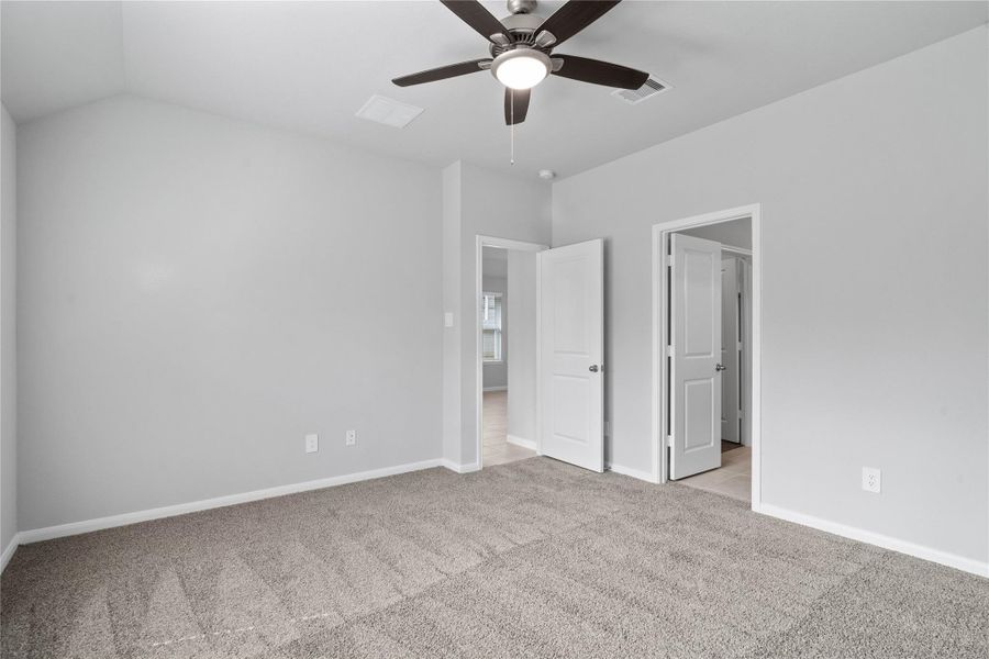 The private primary suite efficiently connects the sleeping area with the dedicated bathroom and generous closet.