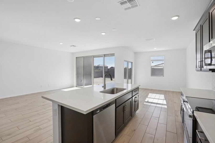 Great room, kitchen and dining. Not actual home, finishes and options may vary.