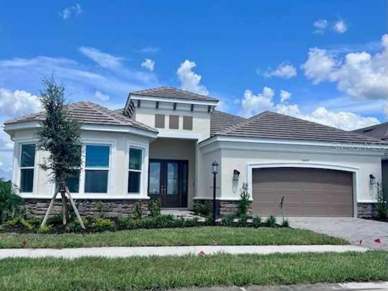 Front exterior of a new home in , Sarasota, FL, highlighting curb appeal (Image 25).