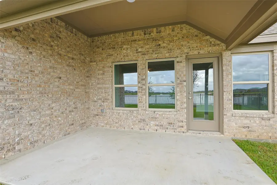 Exterior details and patio area of a home in Sunterra, Katy (Image 19). Exterior details and patio area of a home in Sunterra, Katy (Image 19).
