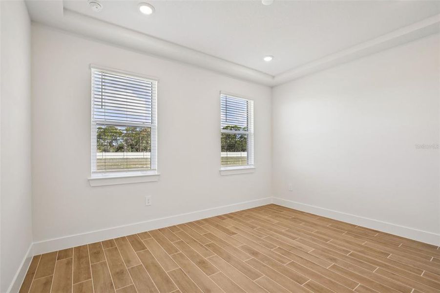 Spacious, unfurnished interior of a new home in Magnolia Bay - Reserve Series, Nokomis (Image 28).