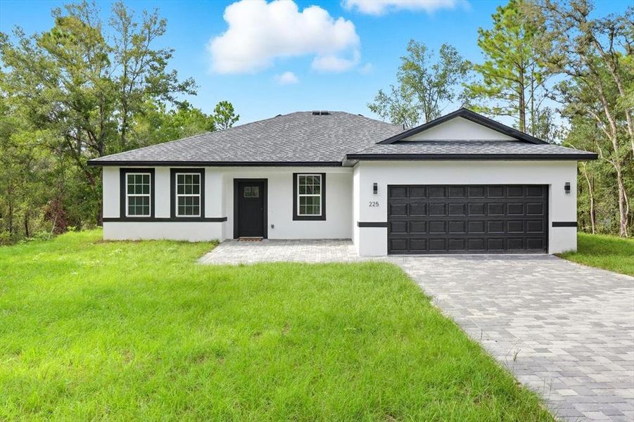 Front exterior of a new home in , Citrus Springs, FL, highlighting curb appeal (Image 20).