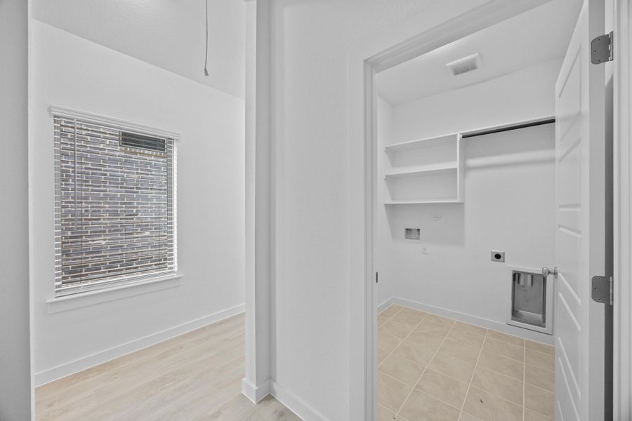 Utility Room in the Pecan II home plan by Trophy Signature Homes – REPRESENTATIVE PHOTO