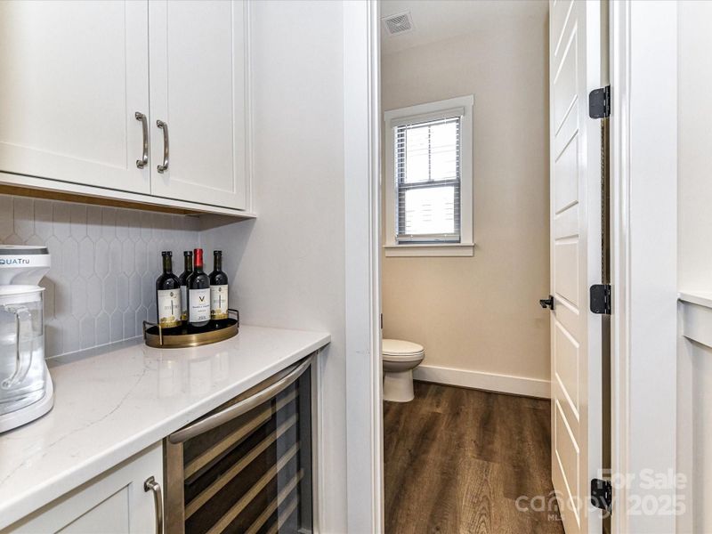 Bar Area with Beverage Refrigerator & custom tile back splash!