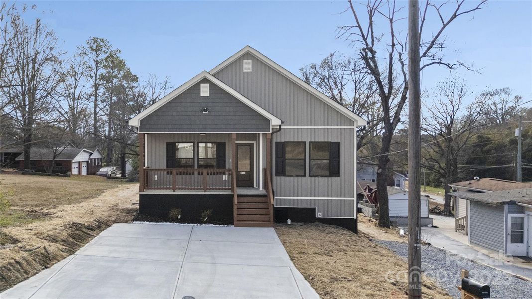 Front exterior of a new home in , Concord, NC, highlighting curb appeal (Image 1). Front exterior of a new home in , Concord, NC, highlighting curb appeal (Image 1).