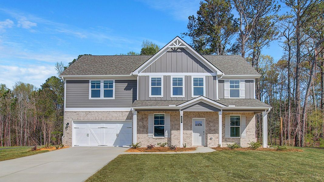 Front exterior of a new home in Copperfield, Locust Grove, GA, highlighting curb appeal (Image 1).