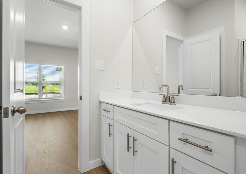 Master bath features beautiful white cabinets. Master bath features beautiful white cabinets.