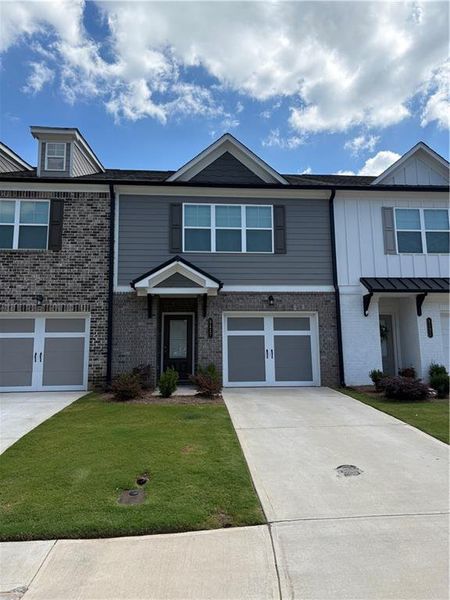 Front exterior of a new home in , Oakwood, GA, highlighting curb appeal (Image 11). Front exterior of a new home in , Oakwood, GA, highlighting curb appeal (Image 11).