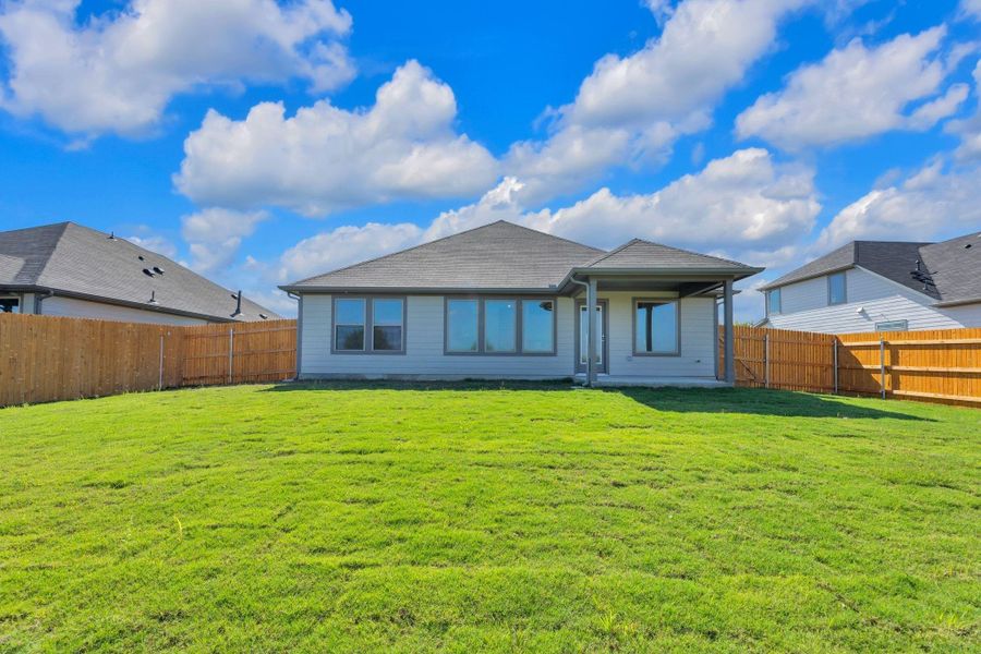 Exterior details and patio area of a home in Prairie Winds, Hutto (Image 4).